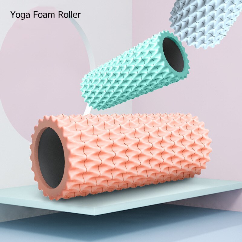 Foam massage roller displayed in ocean blue, deep sea gray, and coral orange colors for yoga and muscle recovery.