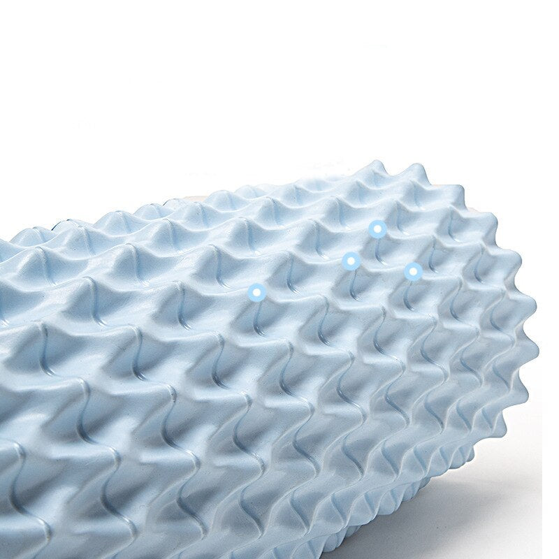 Foam massage roller in ocean blue color with textured surface for effective muscle relaxation and recovery.